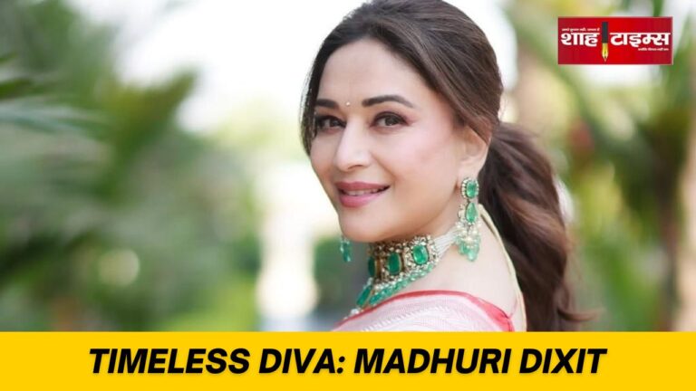 Madhuri Dixit smiling in traditional attire during a public appearance on her 58th birthday