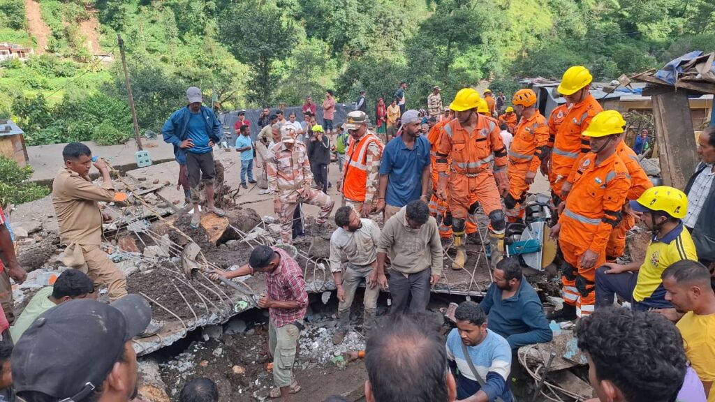 NDRF and SDRF teams with local villagers carrying out rescue operations after Nandanagar disaster in Chamoli, Uttarakhand.