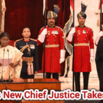 President Droupadi Murmu and the newly sworn-in Chief Justice stand during the oath ceremony at Rashtrapati Bhavan, accompanied by ceremonial guards in uniform.
