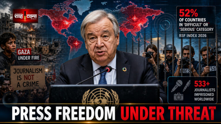 Antonio Guterres speaking at UN podium with global map red alert zones journalists behind bars protest visuals press freedom crisis